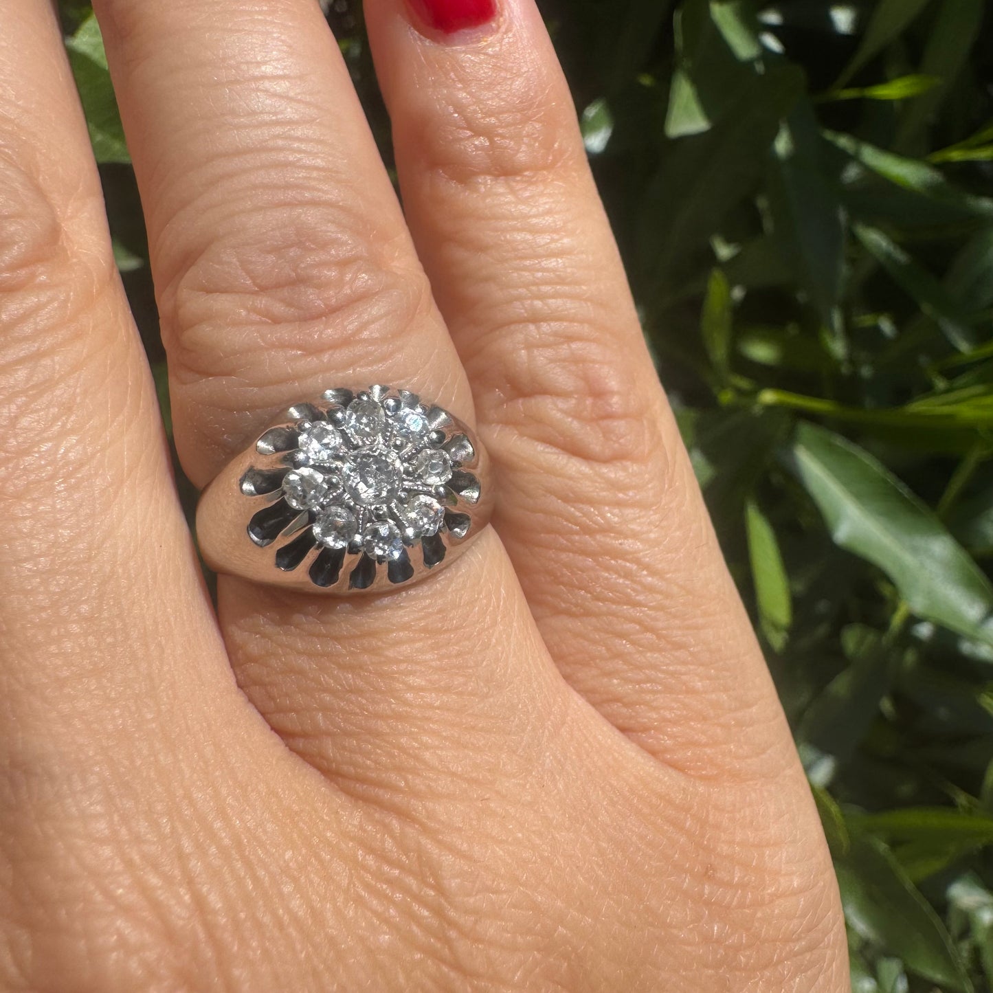 14K gold ring set with a cluster of old cut diamonds arranged in a floral design