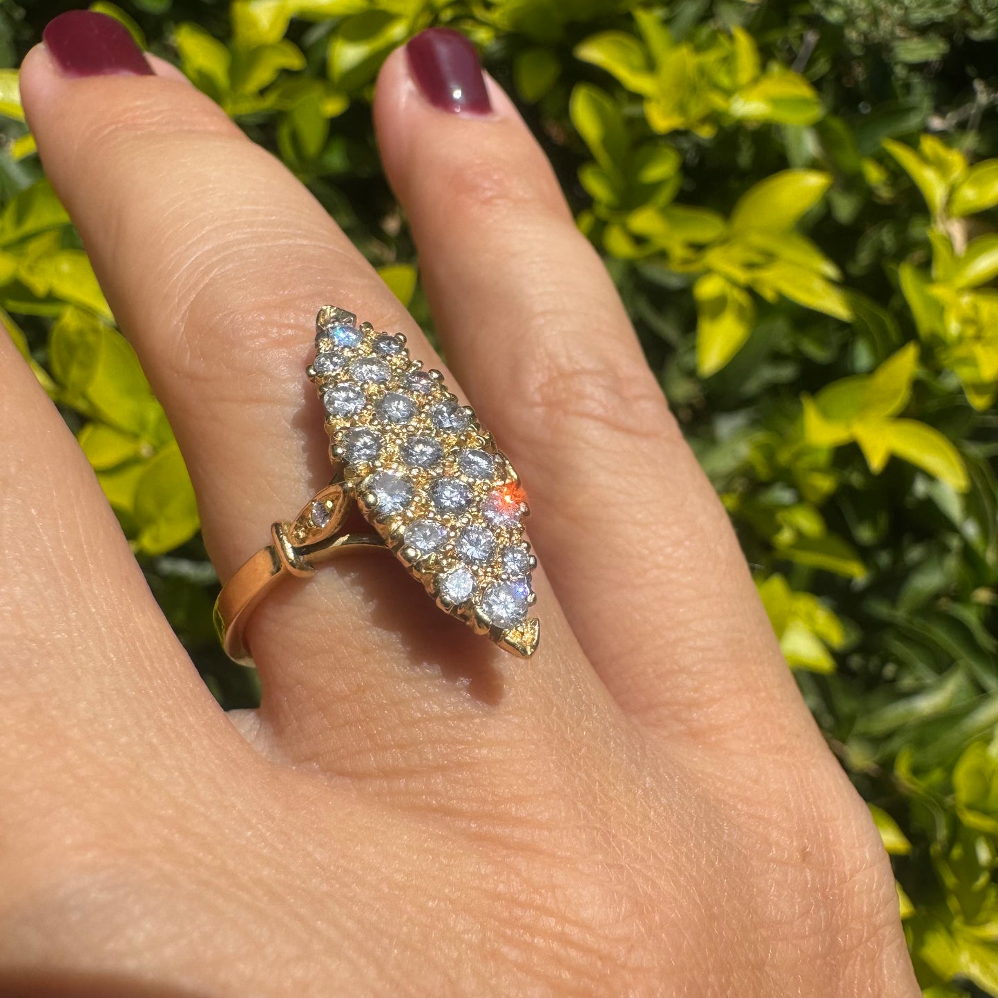 18K gold marquise-shaped ring set with multiple rows of sparkling Diamonds