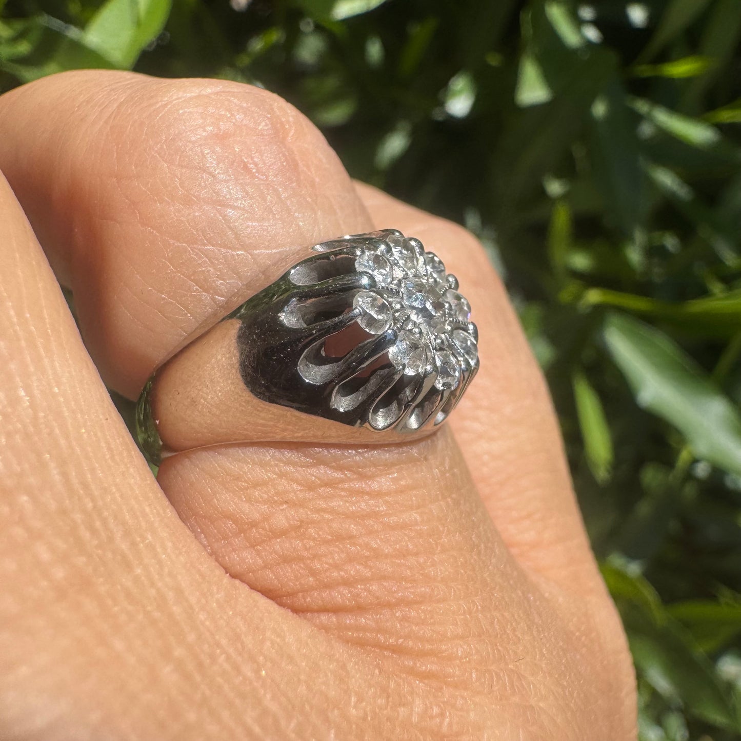 14K gold ring set with a cluster of old cut diamonds arranged in a floral design