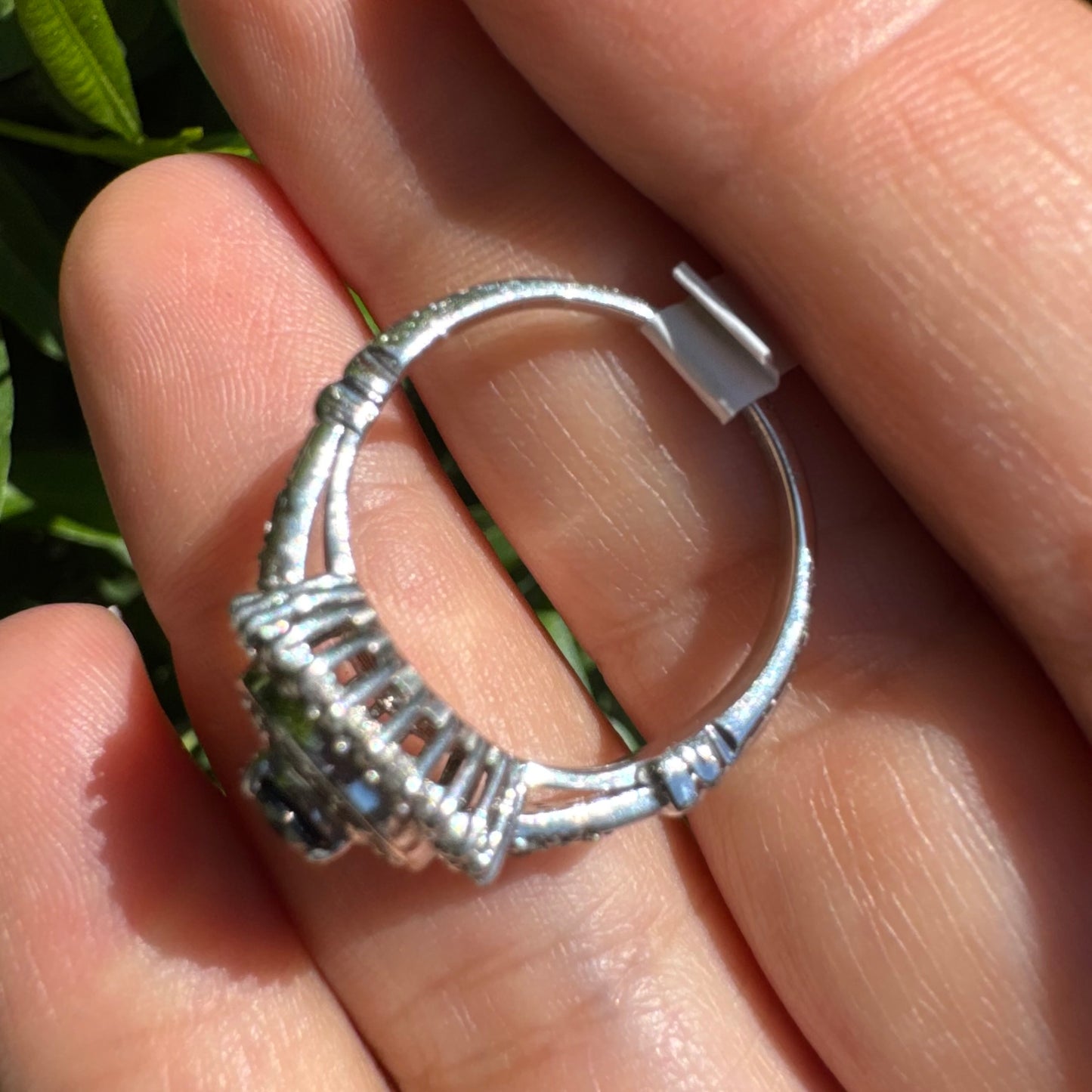 14K gold ring set with an oval-cut Sapphire, surrounded by a stunning double halo of brilliant round Diamonds