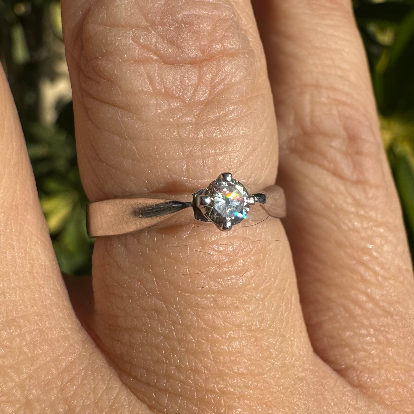 14K gold ring set with one center Diamond