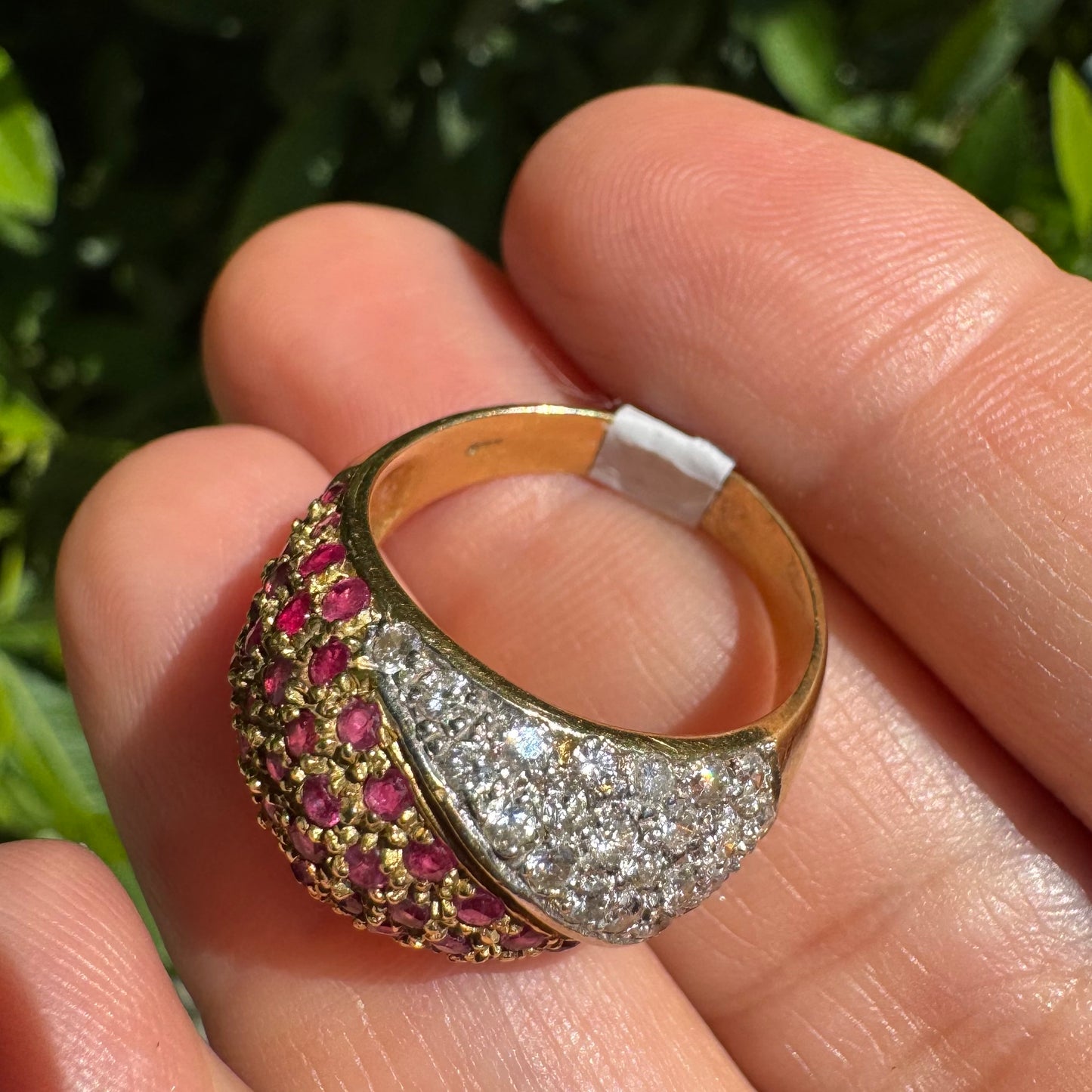 14K gold dome ring pavé-set with Diamonds and vivid Rubies in a striking two-tone design