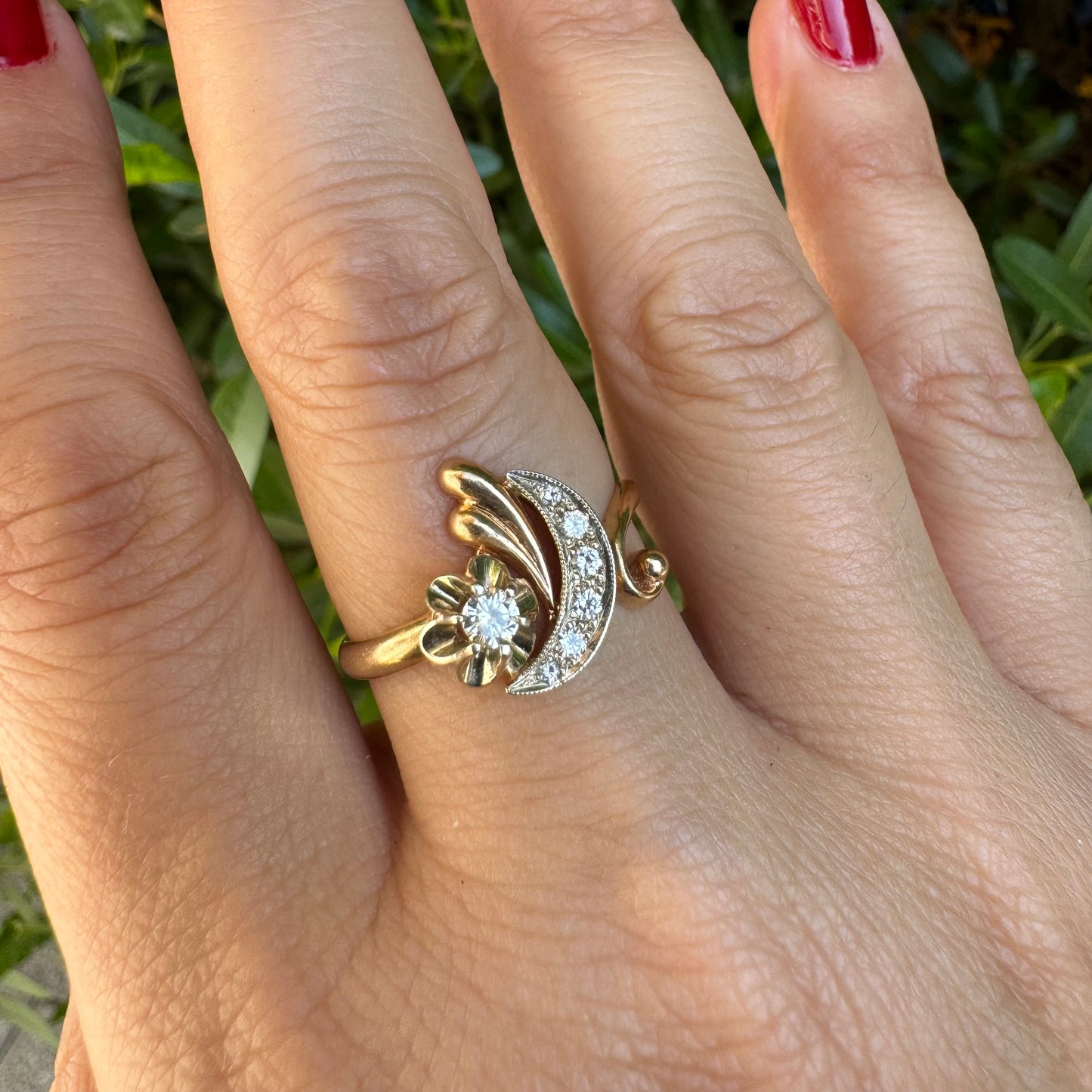 14K gold ring with a delicate moon and star motif set with Diamonds