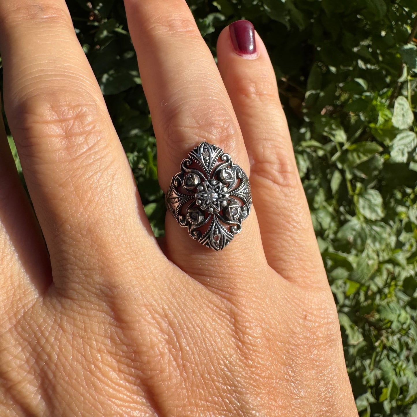 18K gold & silver ring with an intricate floral and leaf filigree design set with Diamonds