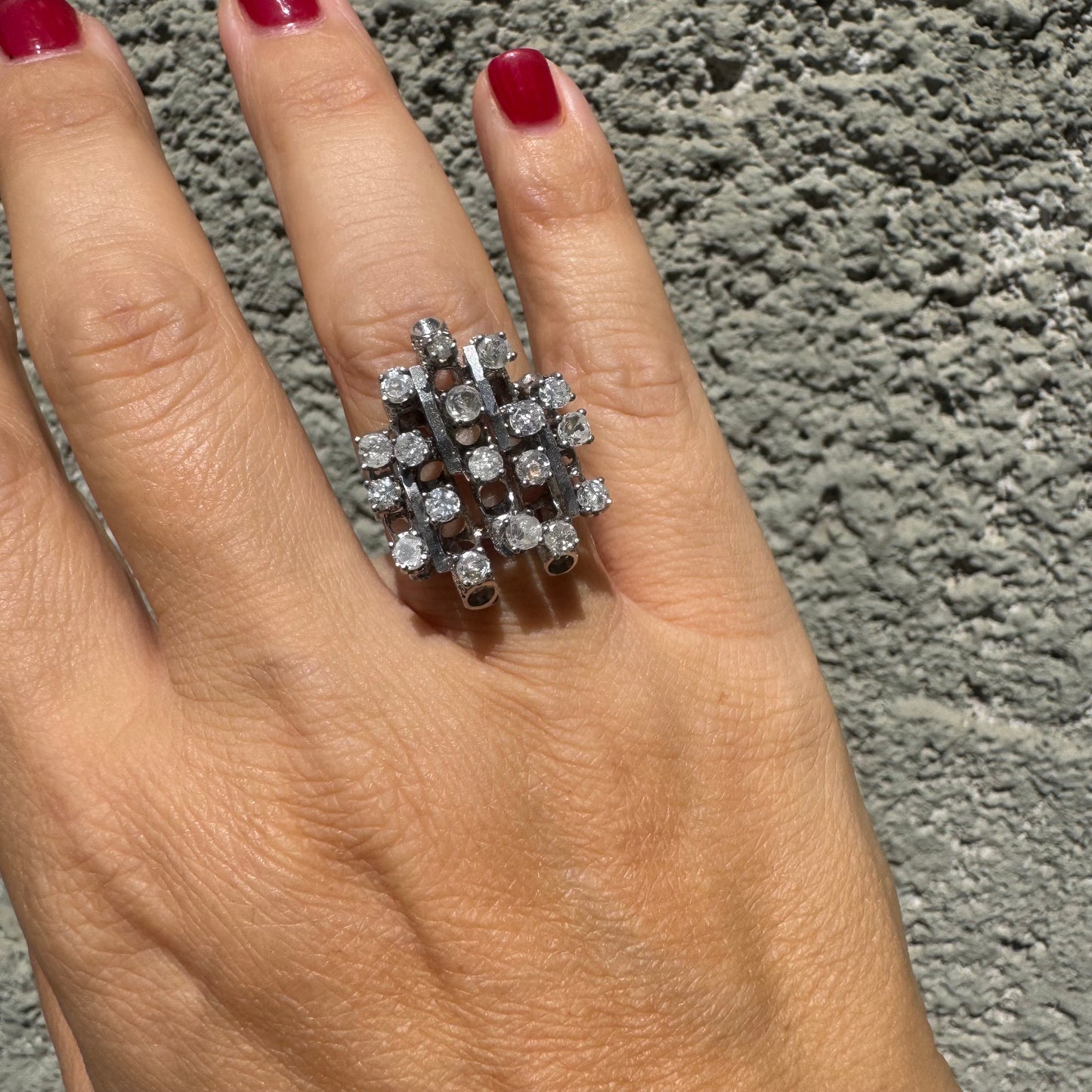 14K gold ring with a geometric design, set with multiple round Diamonds that create a sparkling, structured look.