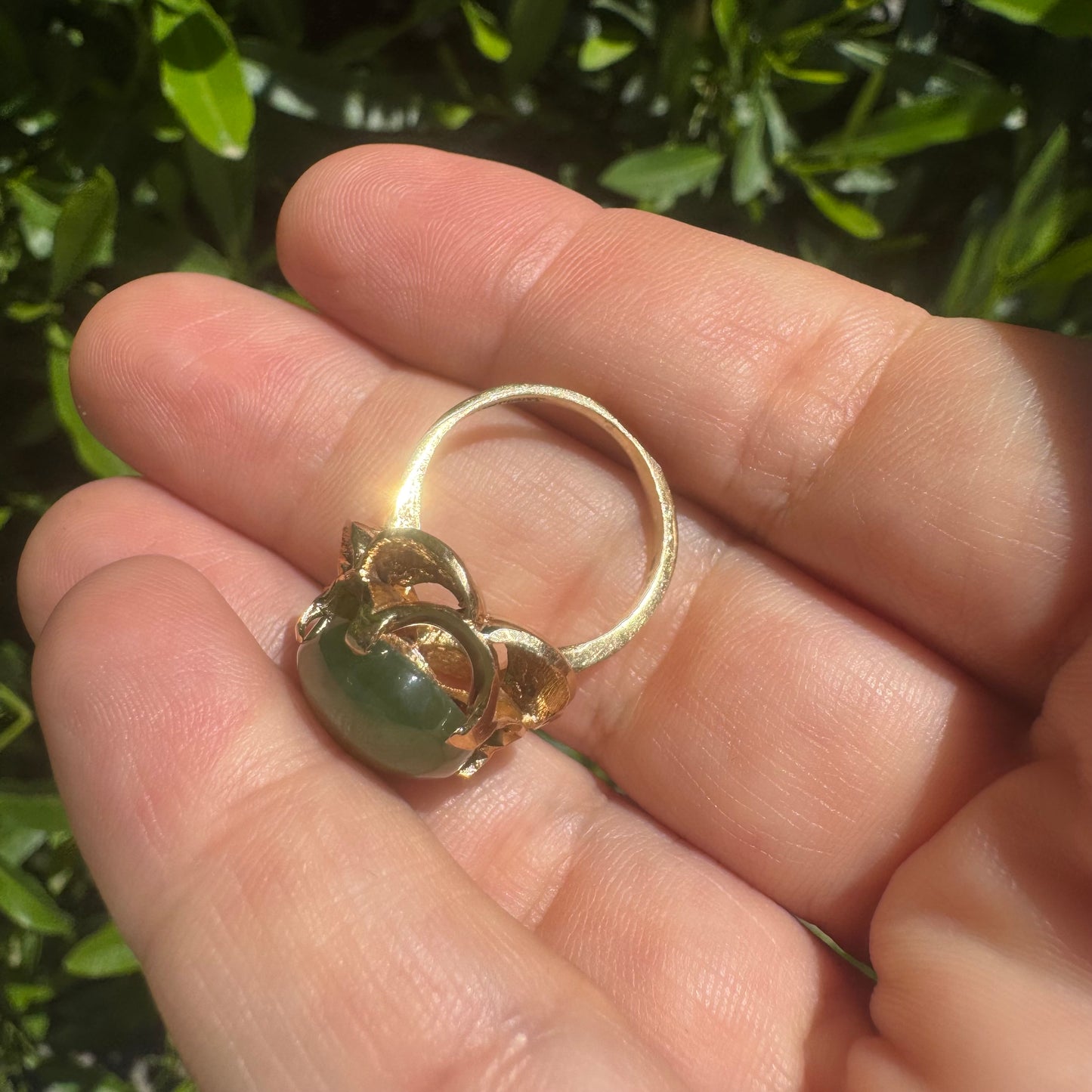14K gold ring set with a large green Jade cabochon