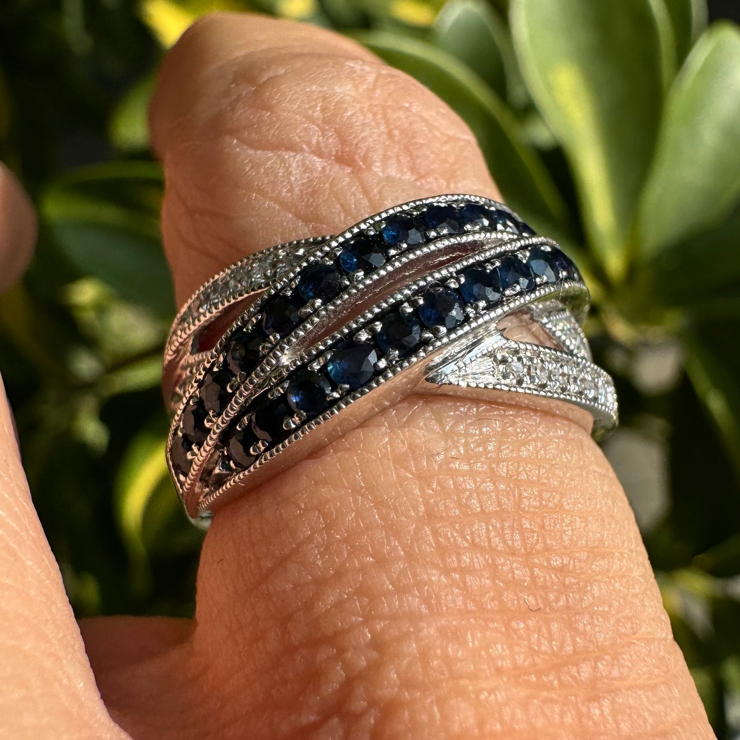 14K gold crossover ring set with Sapphires and sparkling Diamonds