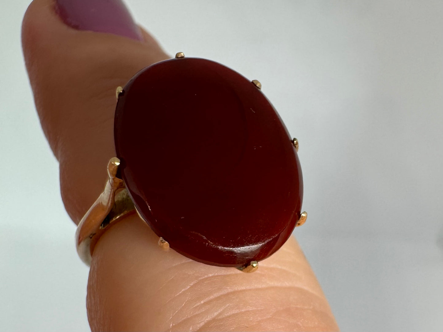14K gold ring set with a glowing oval Carnelian