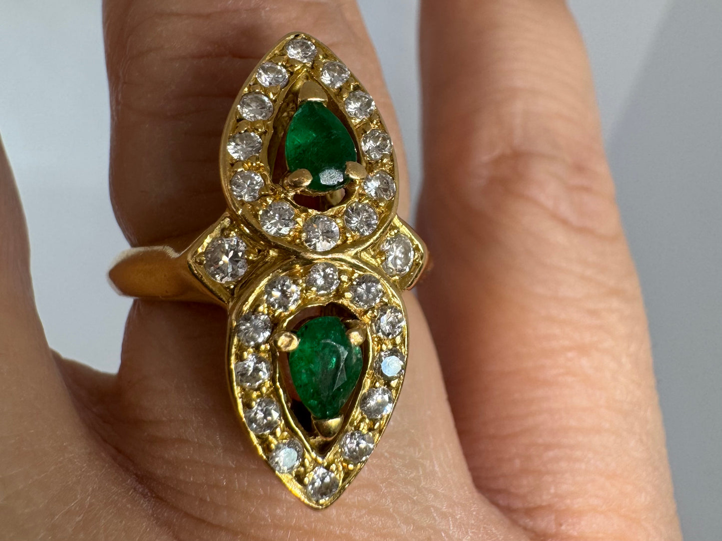 18K gold ring set with two pear-cut Emeralds & Diamonds