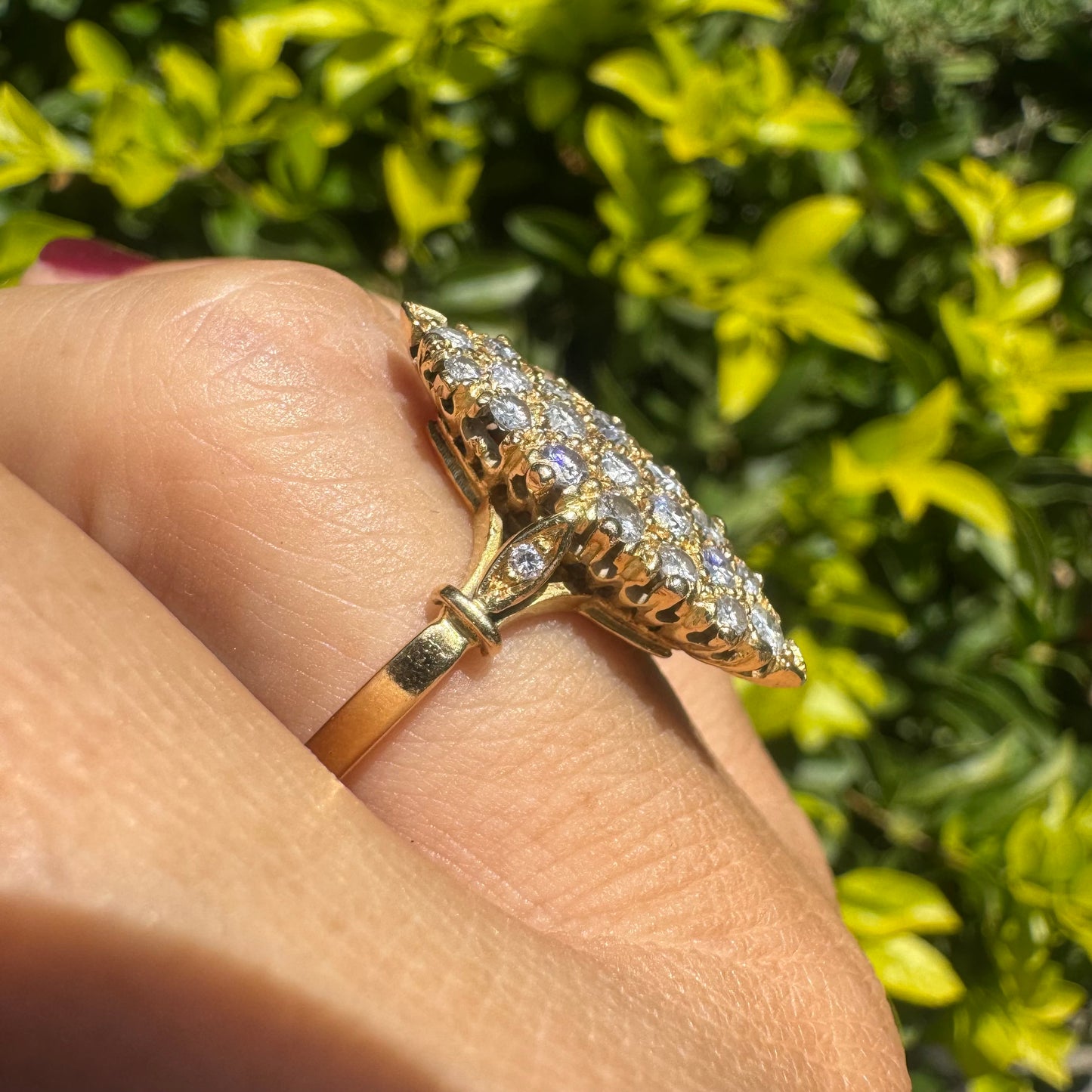 18K gold marquise-shaped ring set with multiple rows of sparkling Diamonds