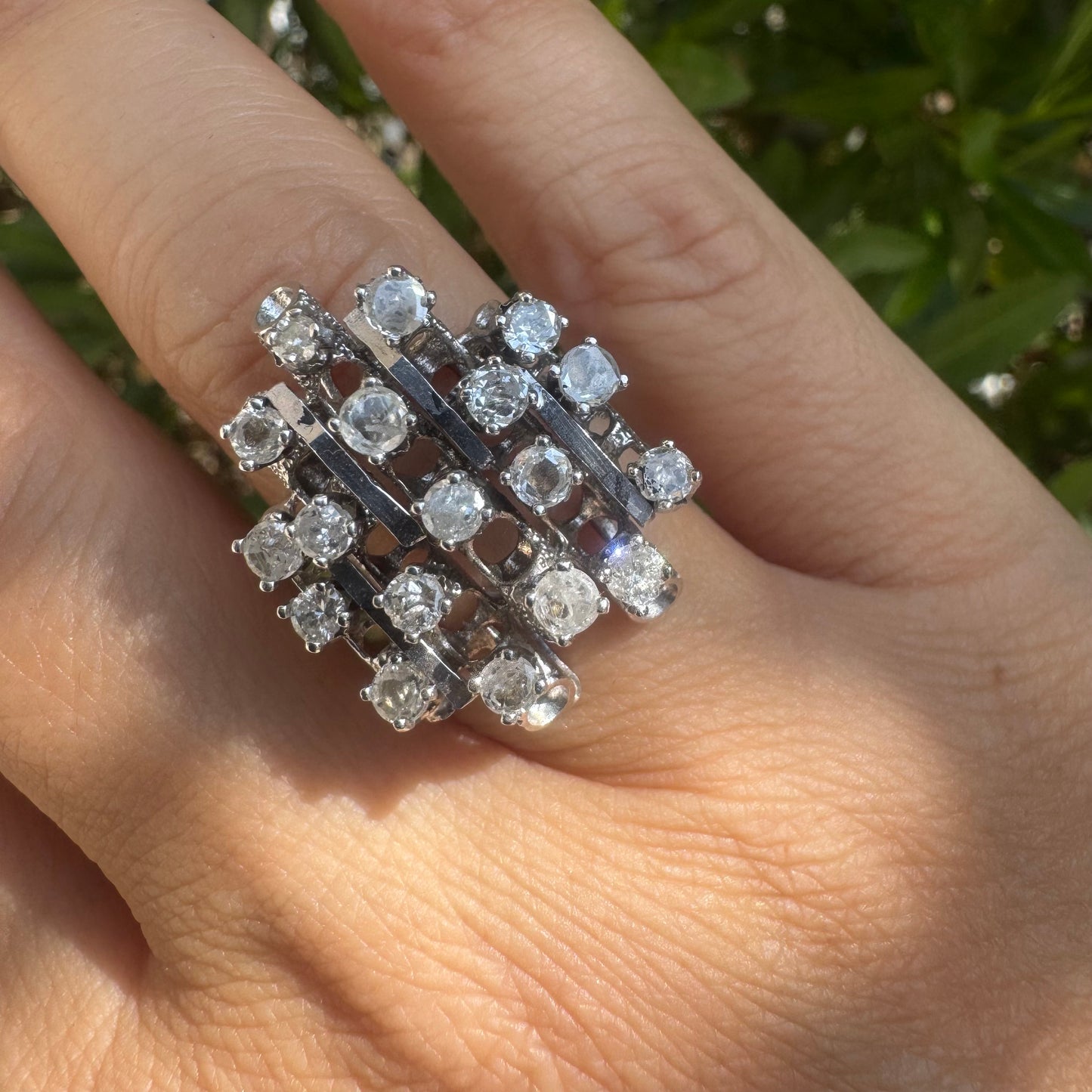 14K gold ring with a geometric design, set with multiple round Diamonds that create a sparkling, structured look.