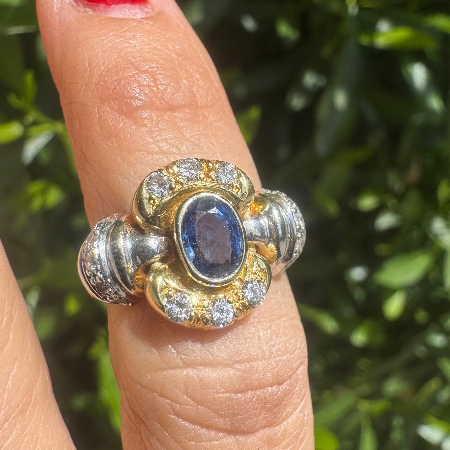 18K two-tone gold ring set with an oval Tanzanite & round brilliant diamonds