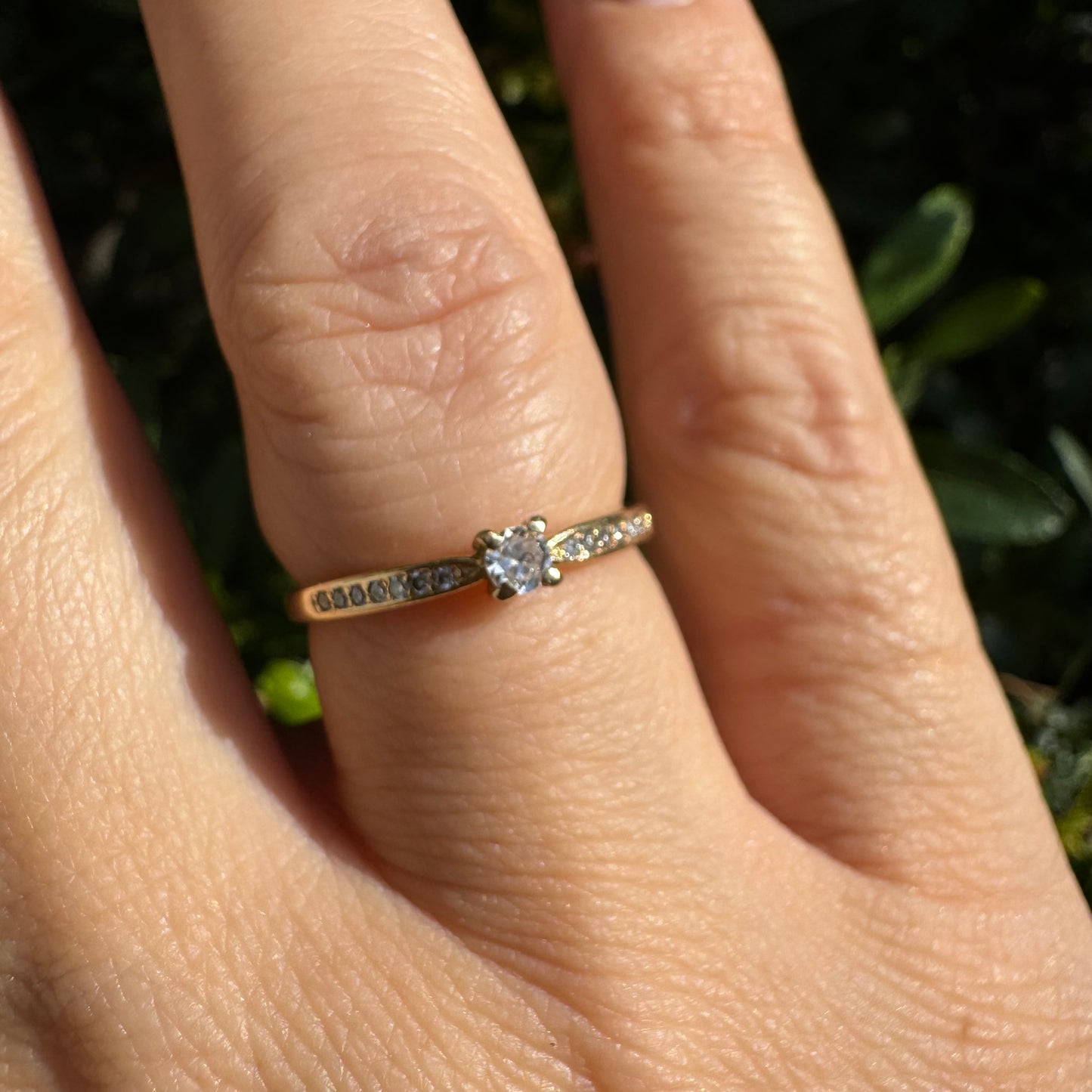 14K gold ring set with one center Diamond and side Diamonds