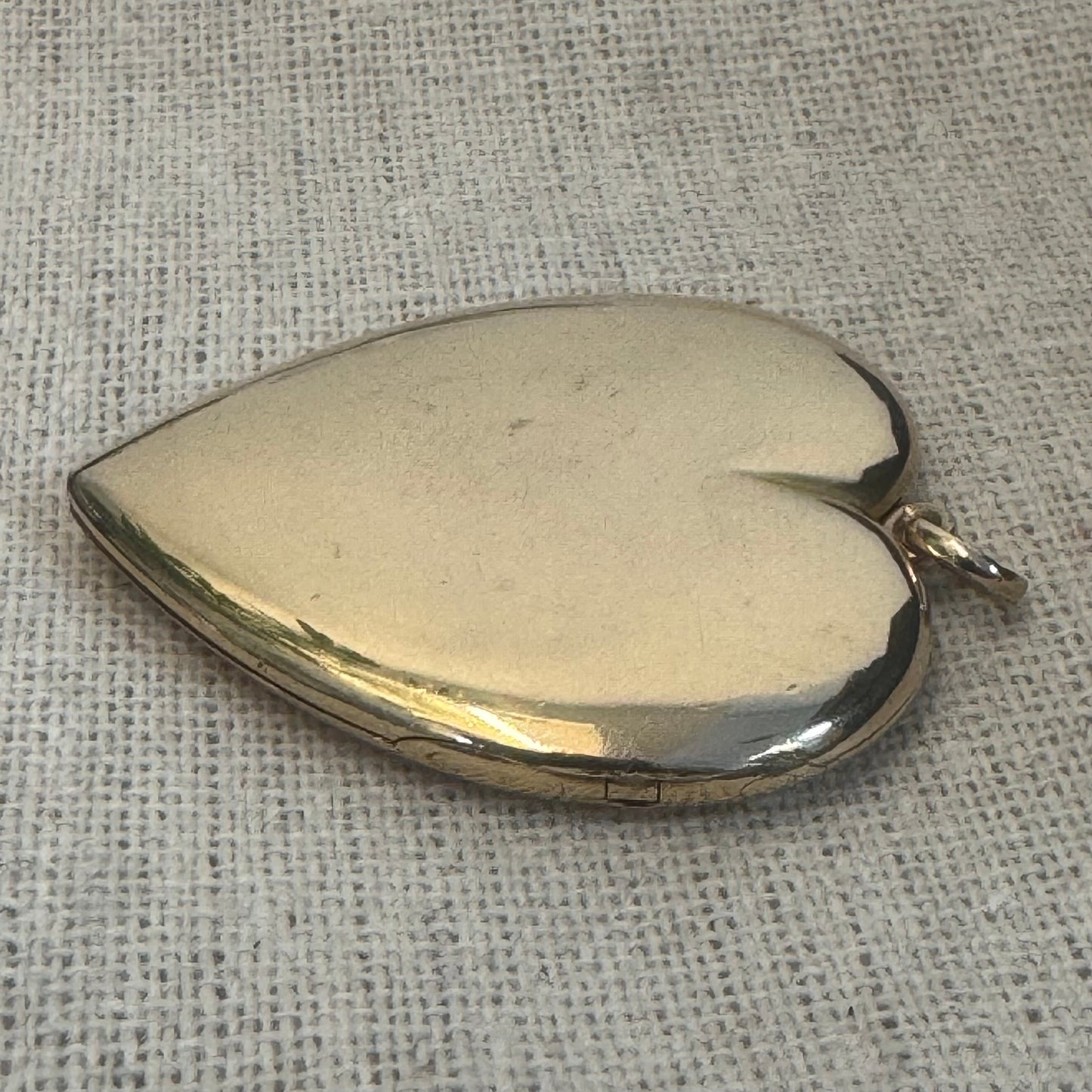 14K gold heart locket in smooth, polished gold tone