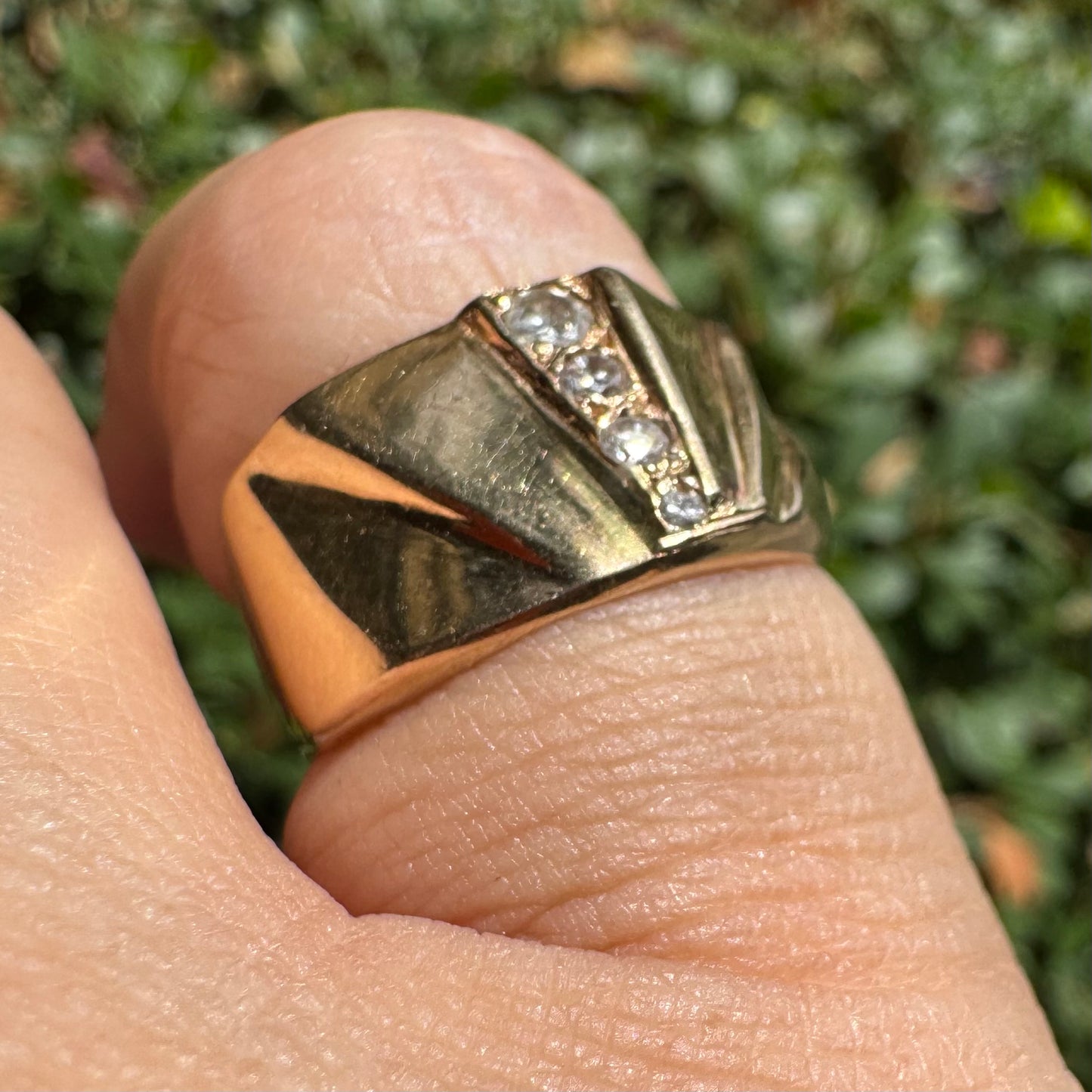 14K gold ring set with Diamonds featuring a fan-like geometric design