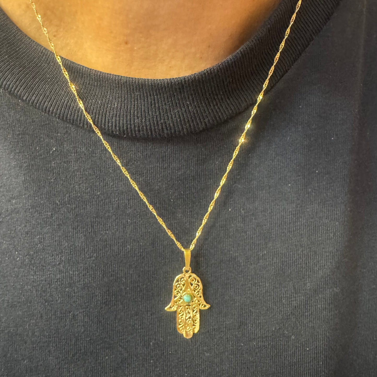 14K gold necklace with “Hamsa” pendant set with a center Turquoise stone