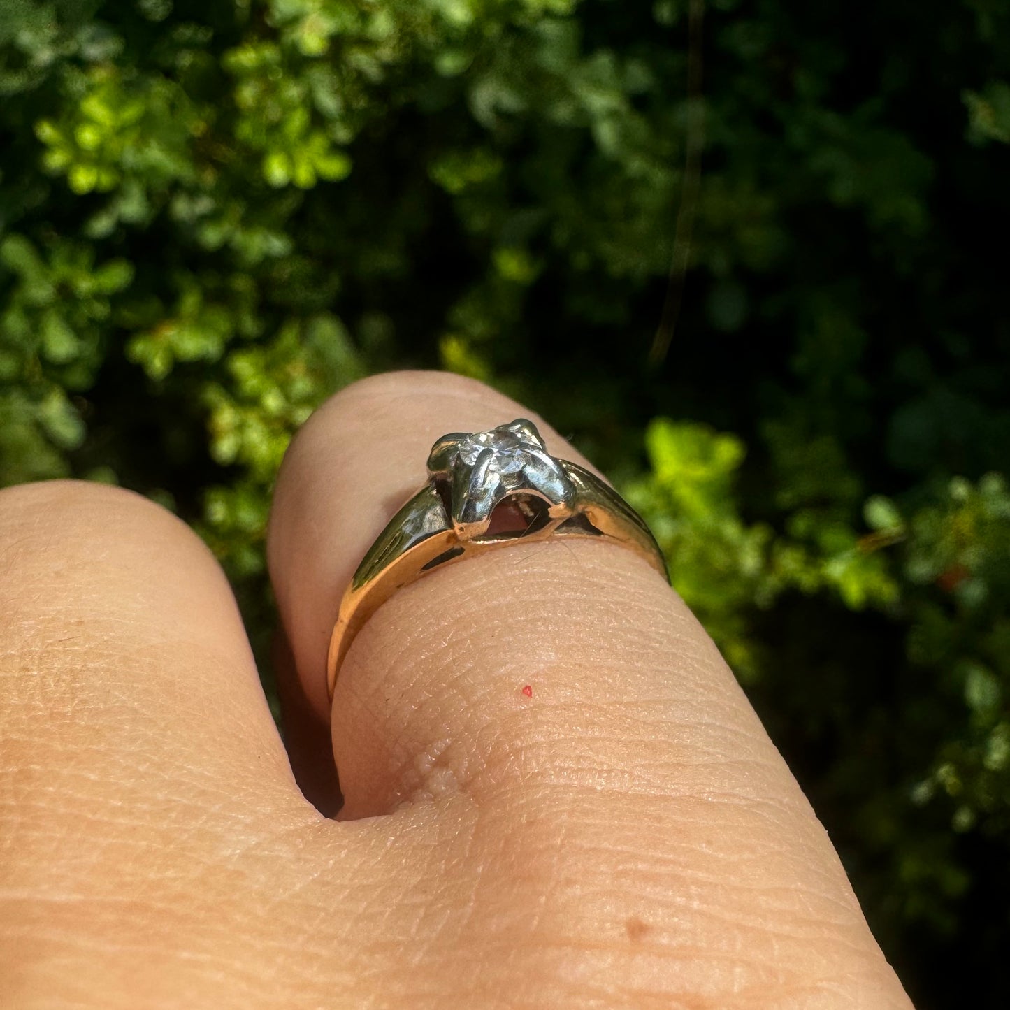 14K gold ring set with one center Diamond