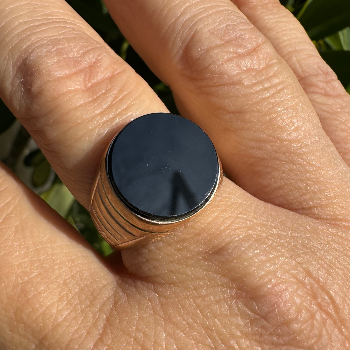 14K gold signet ring crafted in yellow gold, set with a smooth Black Onyx.