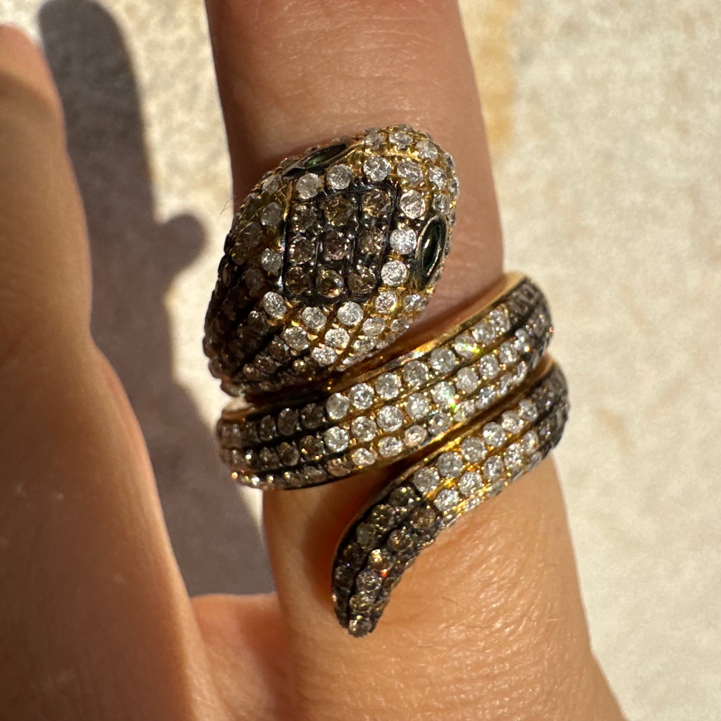 14K gold snake ring fully set with white and black Diamonds, creating a striking contrast and luxurious sparkle.