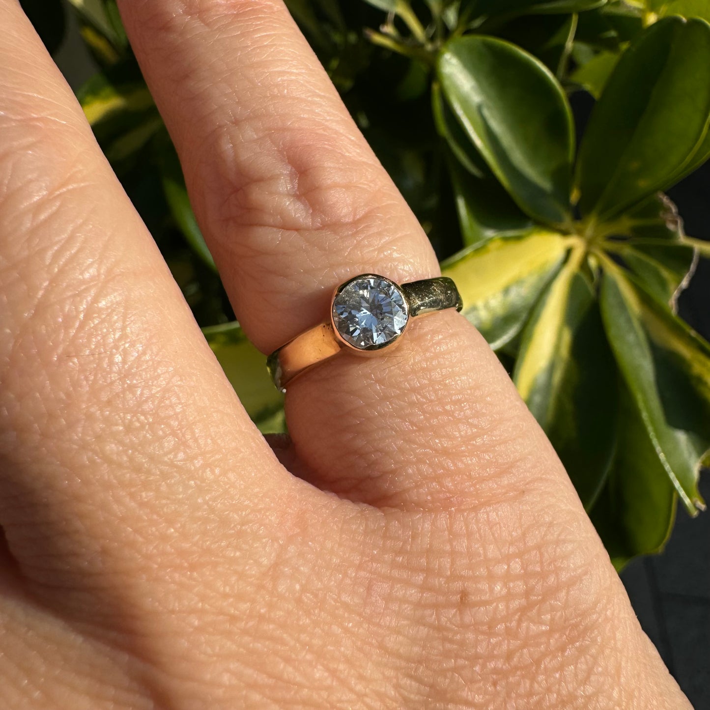 14K gold ring set with one center Diamond