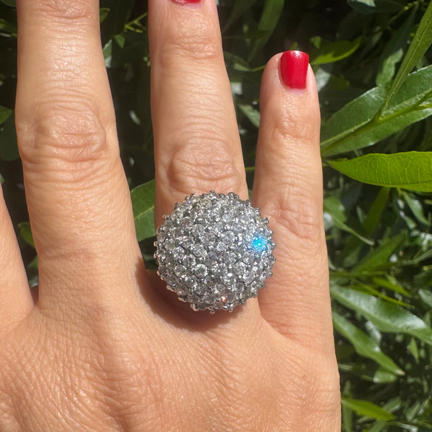 18K gold ring set with Diamonds in a bold pavé setting.