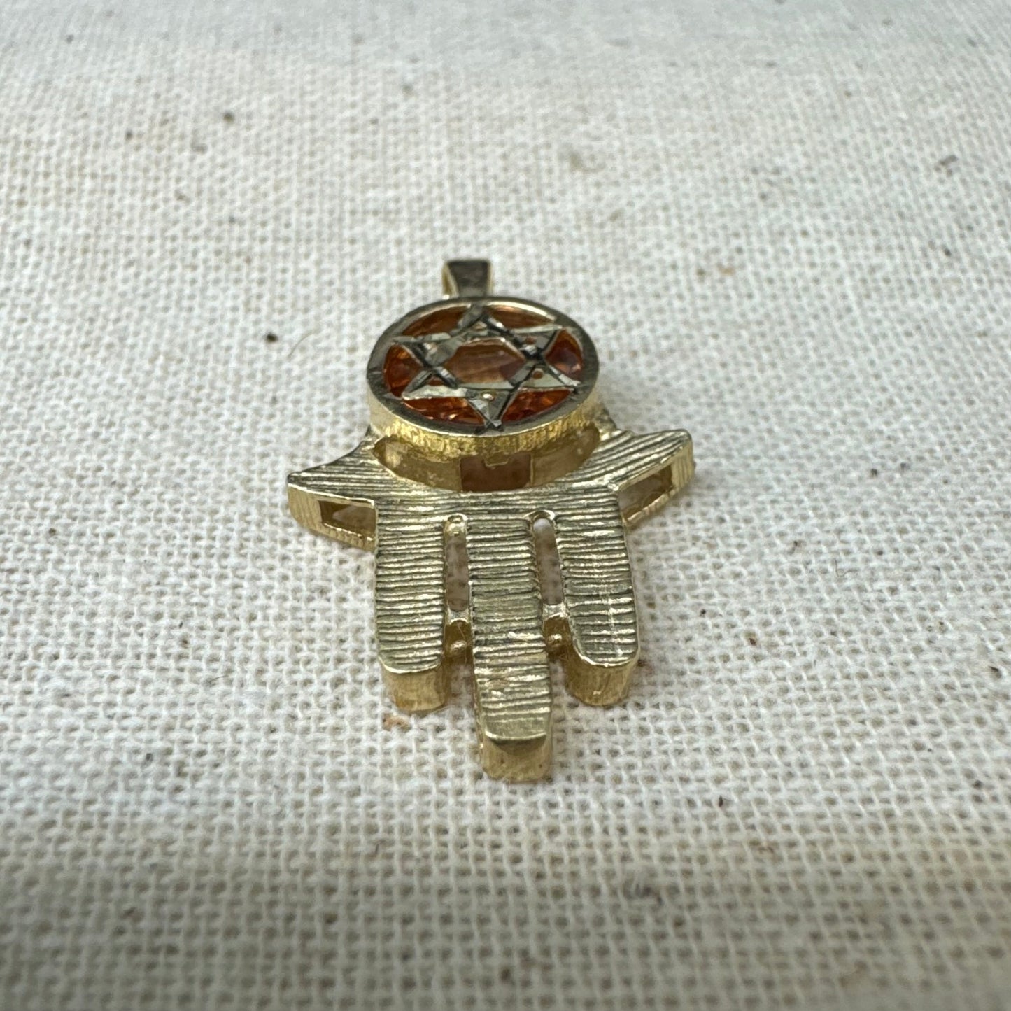 14K gold Hamsa pendant, featuring a deep orange gemstone framed by a Star of David.