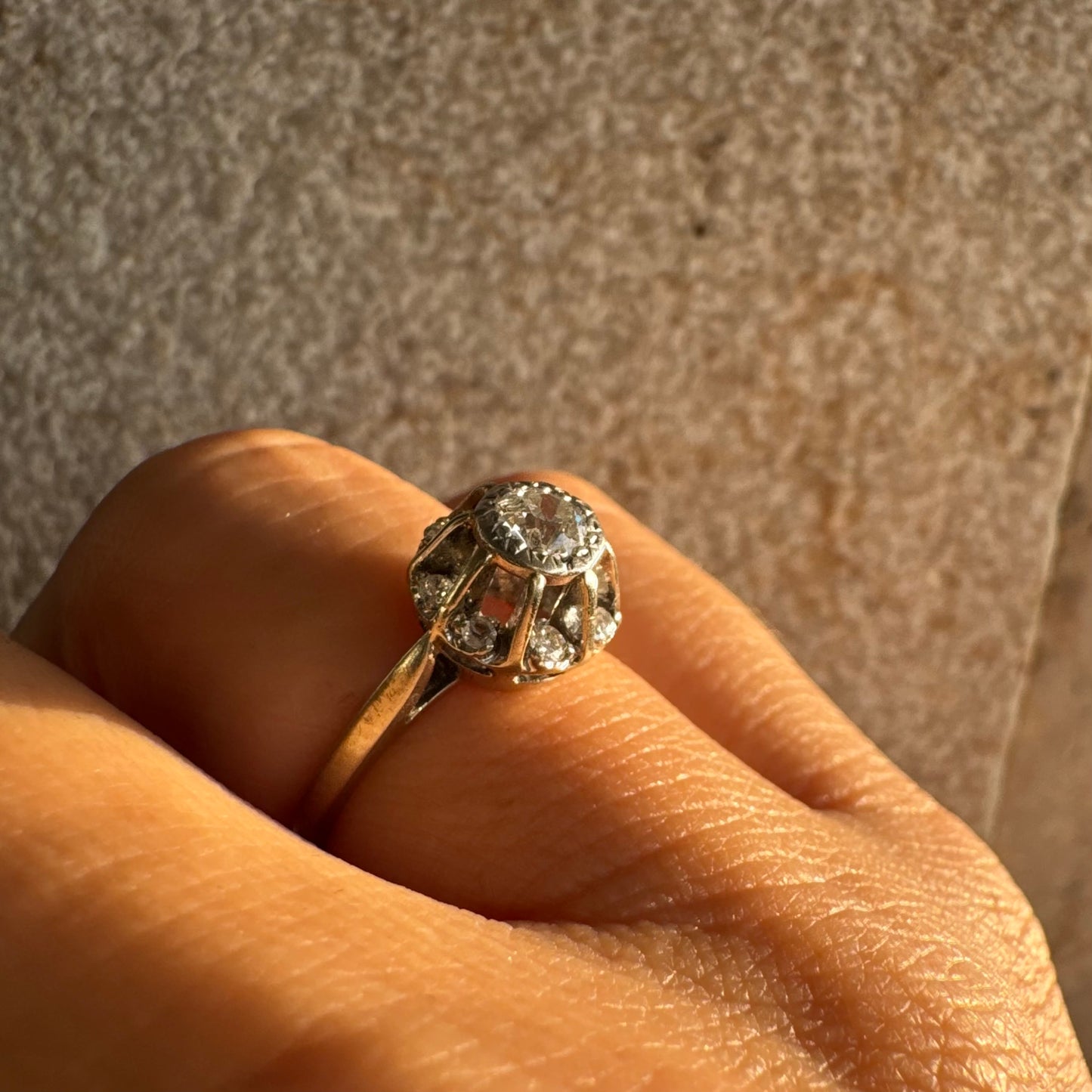 18K gold ring set with Diamonds in     a classic cluster-style