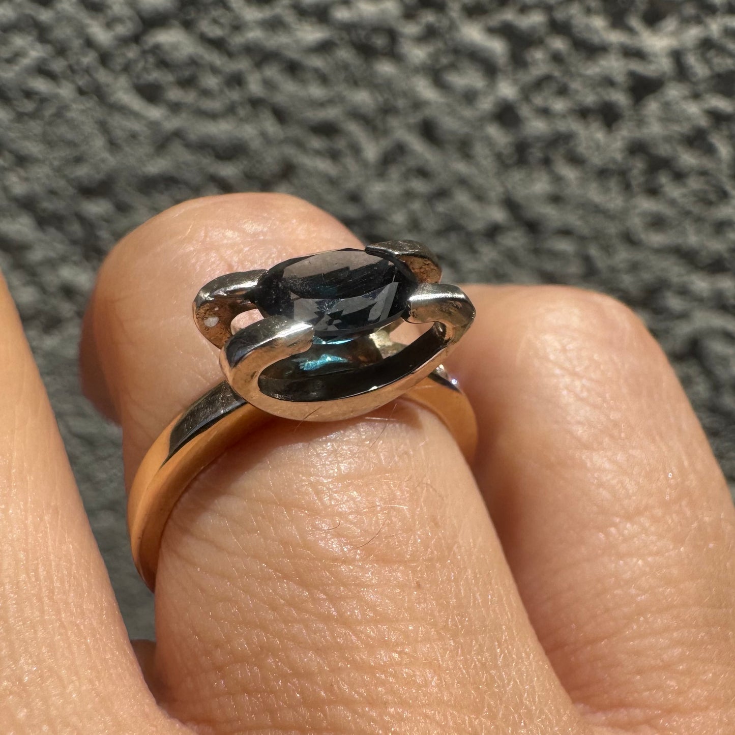 14K gold ring set with an oval-cut Blue Topaz “London”