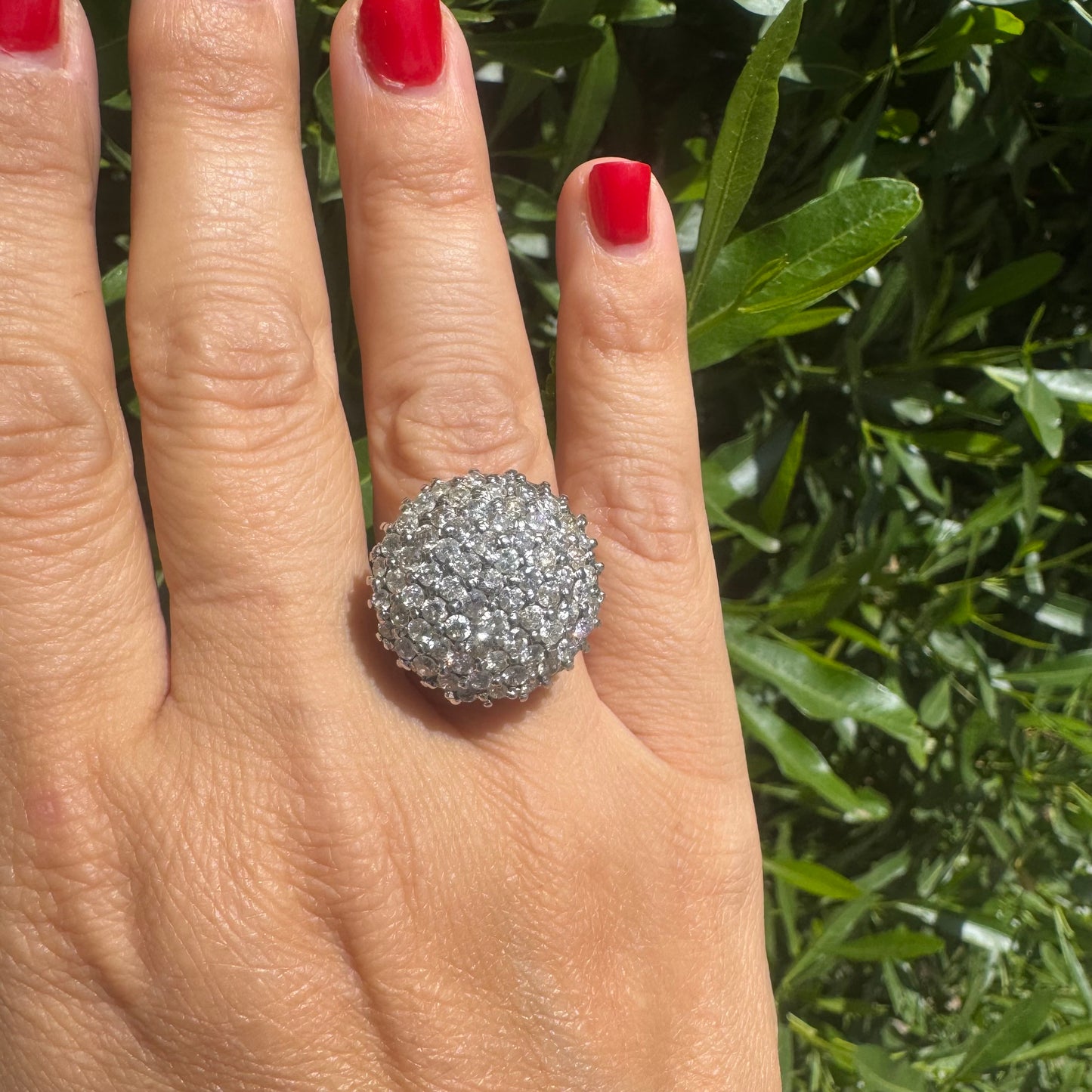 18K gold ring set with Diamonds in a bold pavé setting.