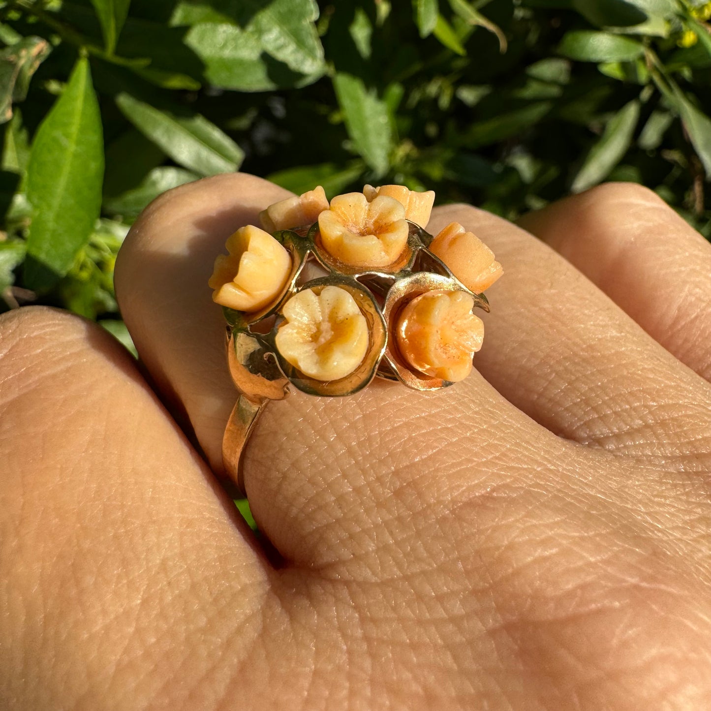 9K gold ring featuring a cluster design with carved Coral flowers in warm orange tones