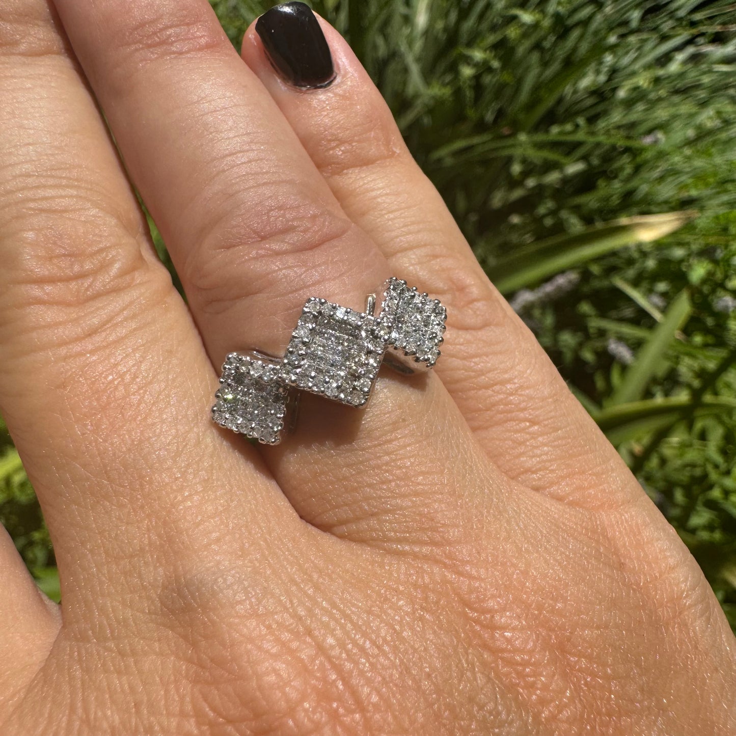 14K gold ring with three square clusters of sparkling Diamonds