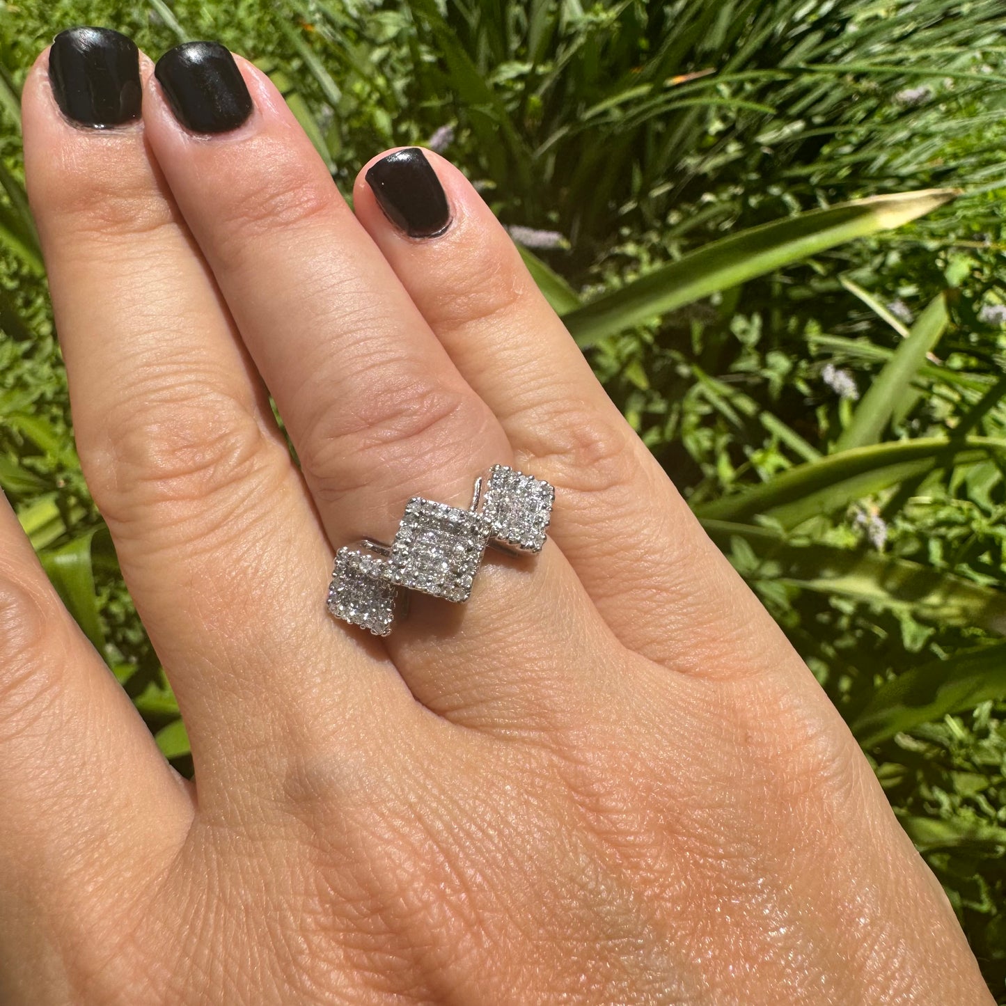 14K gold ring with three square clusters of sparkling Diamonds