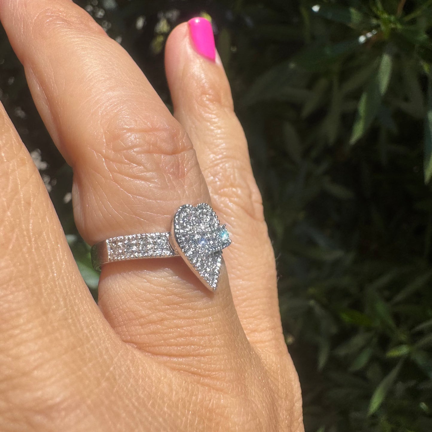 14K gold heart-shaped ring encrusted with shimmering Diamonds