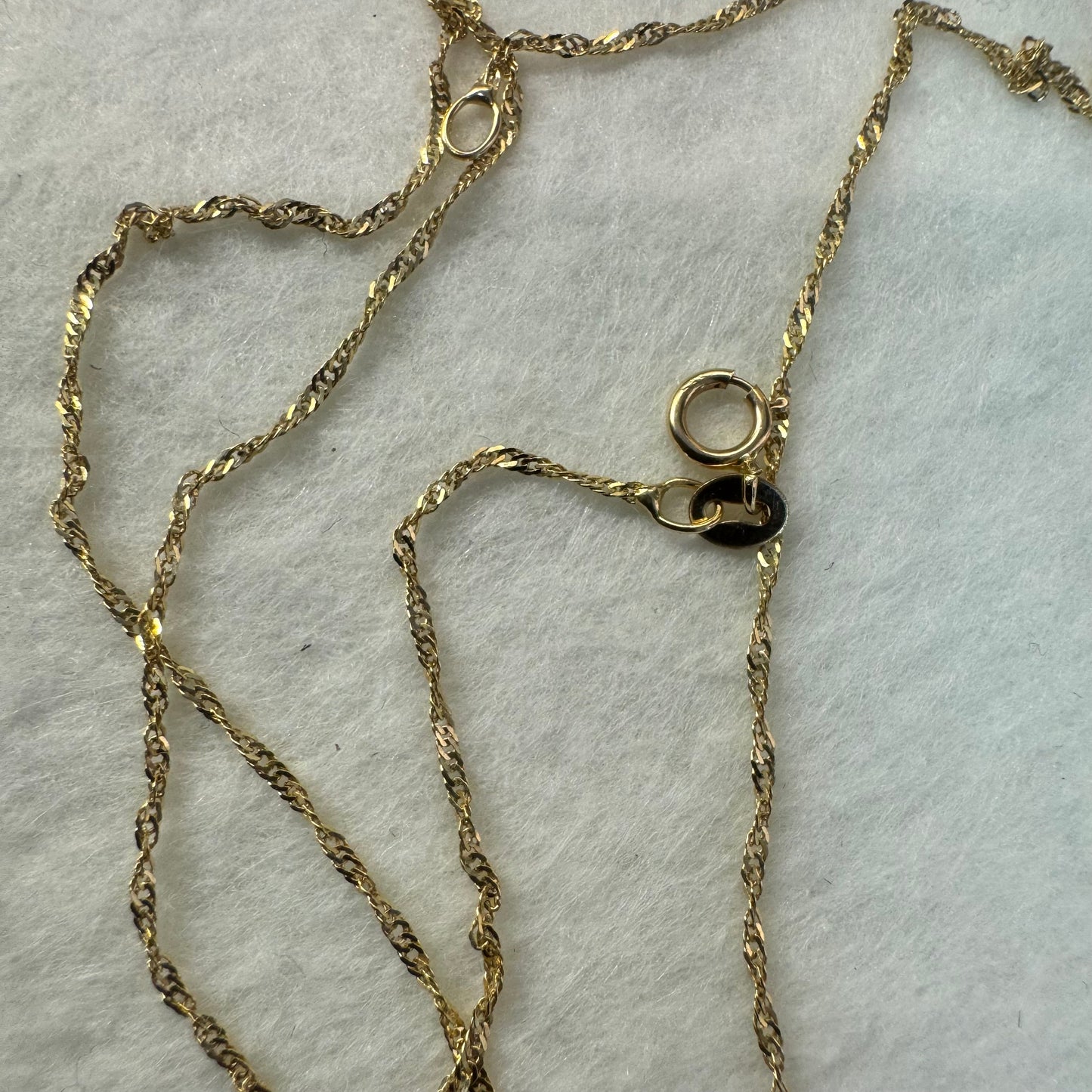 14K gold necklace with “Hamsa” pendant set with a center Turquoise stone