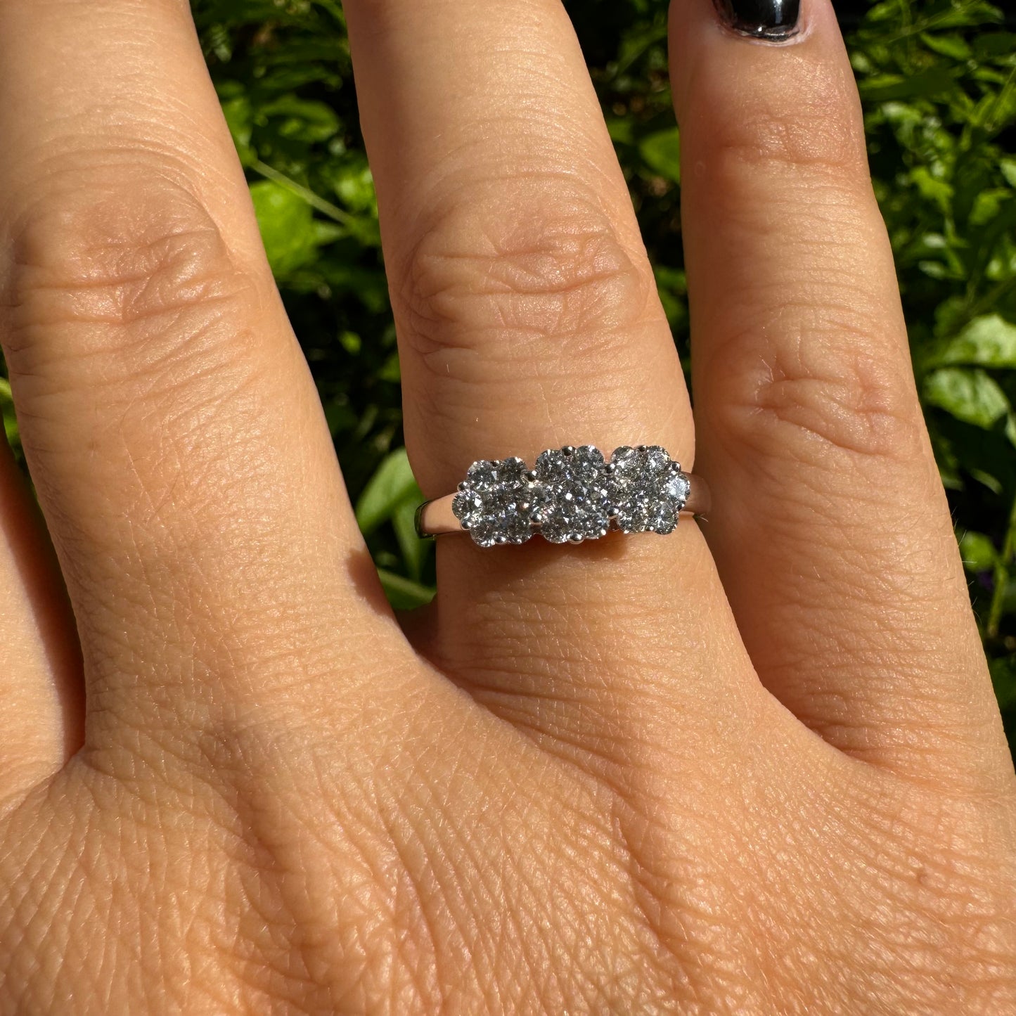 14K white gold ring set with clusters of brilliant white Diamonds