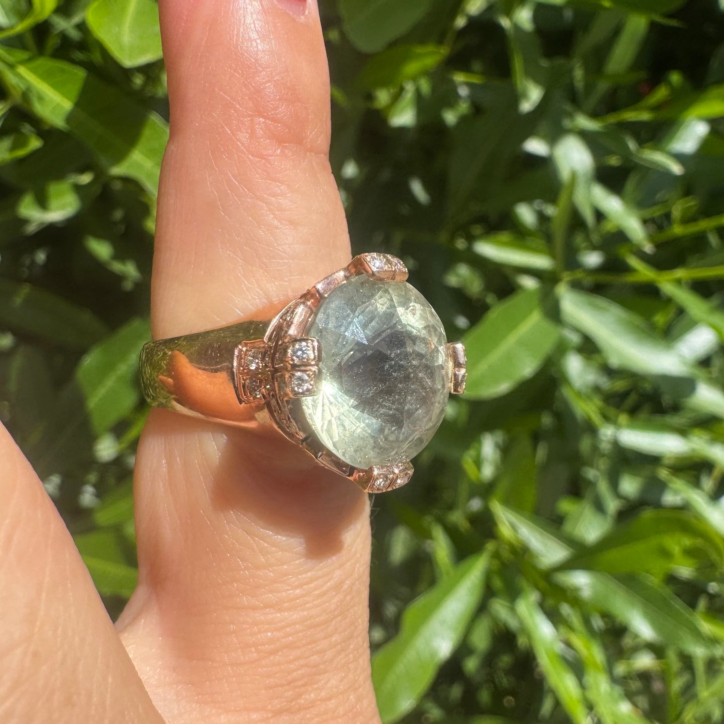 18K gold ring set with a stunning faceted Prasiolite, delicately accented with Diamonds on each prong