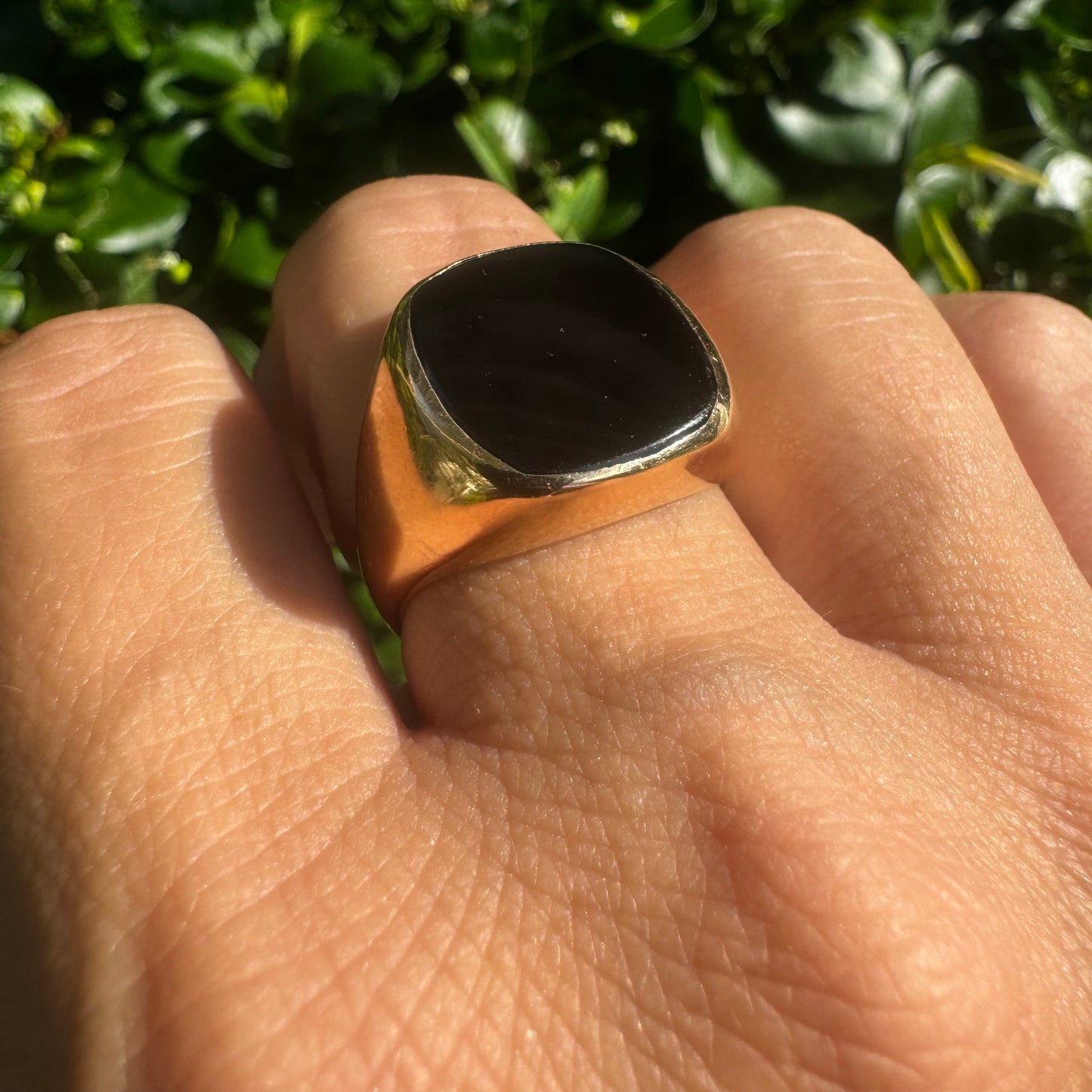 14K bold gold ring set with a smooth, square-shaped black Onyx that creates a sleek and striking look.