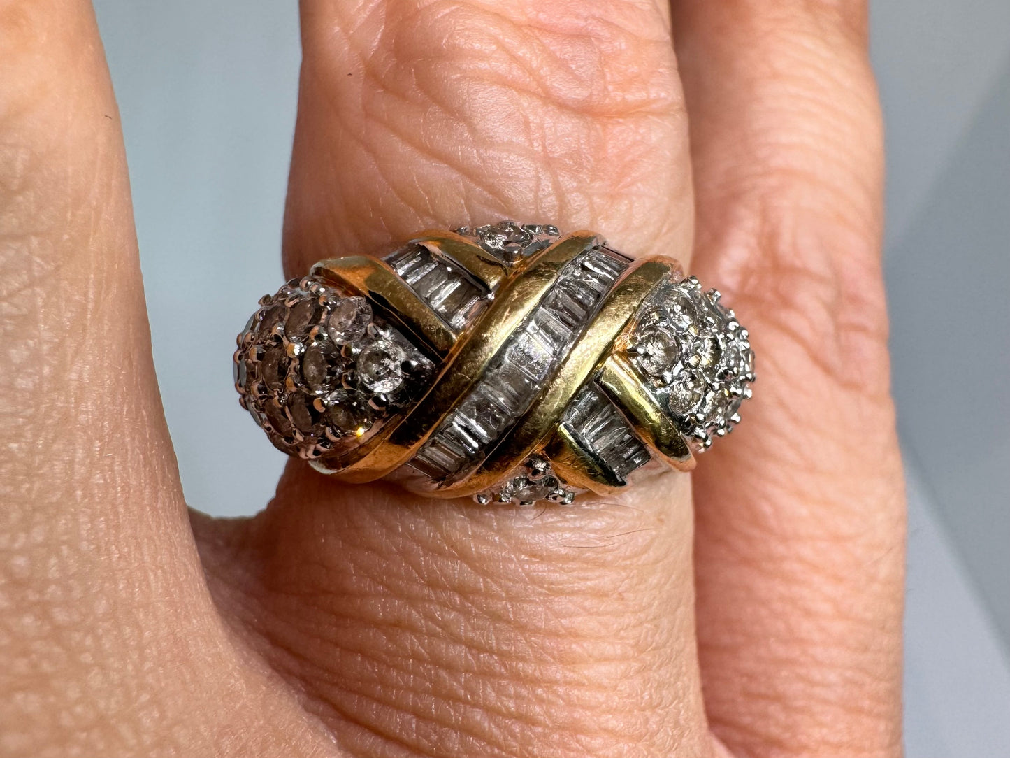 14K gold ring set with crisscrossed rows of baguette and round-cut Diamonds