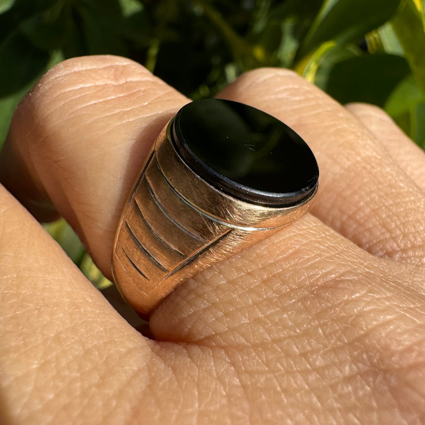 14K gold signet ring crafted in yellow gold, set with a smooth Black Onyx.