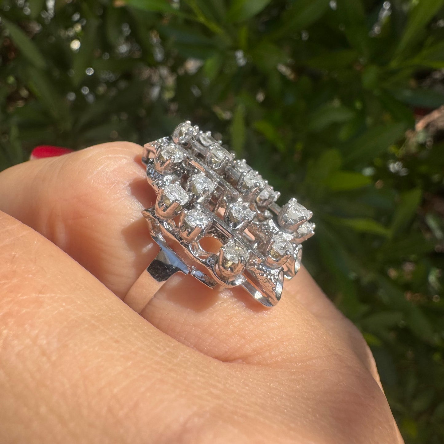 14K gold ring with a geometric design, set with multiple round Diamonds that create a sparkling, structured look.