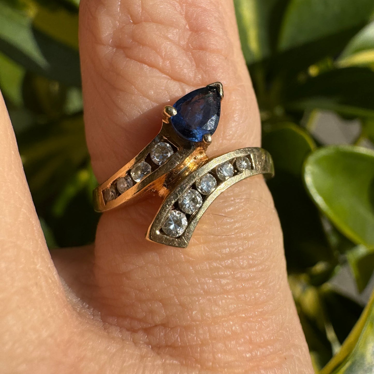 14K gold ring set with a teardrop-shaped Sapphire & Diamonds