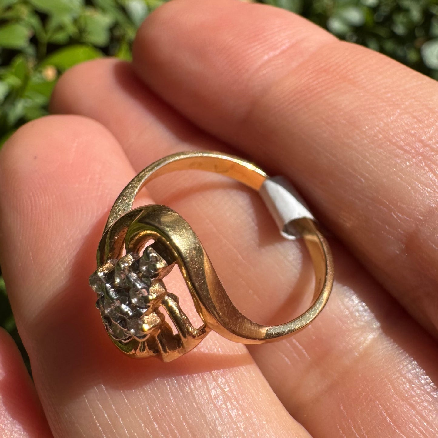 14K gold set with a cluster of sparkling Diamonds at its center