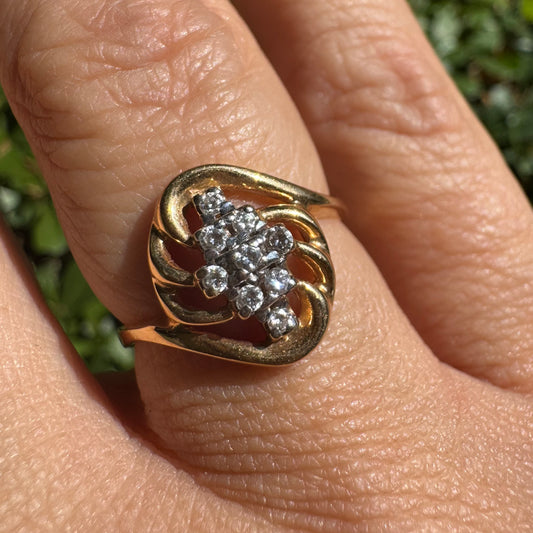 14K gold set with a cluster of sparkling Diamonds at its center