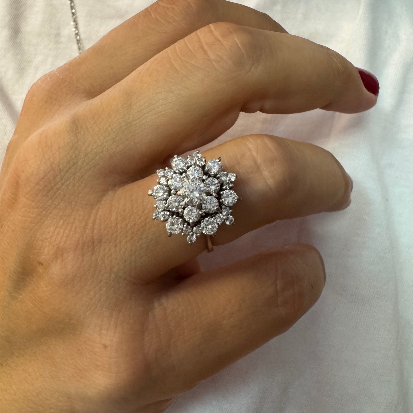 18K gold ring set with sparkling white Diamonds arranged in a floral cluster design