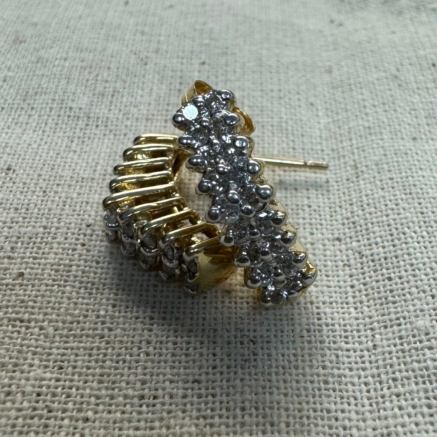 14K gold half-hoop earrings set with sparkling Diamonds in a dense pavé setting