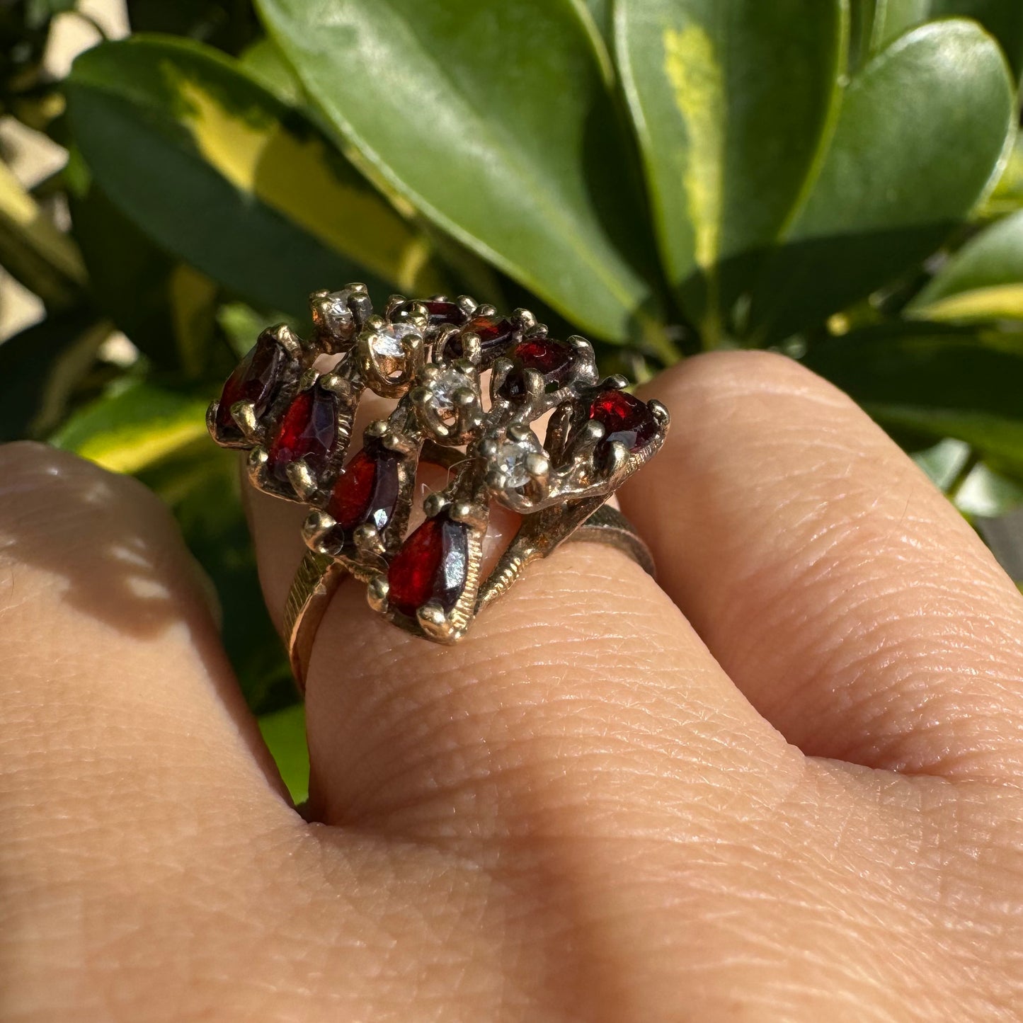 14K gold ring set with deep red teardrop Garnets and sparkling Diamonds in an openwork geometric design