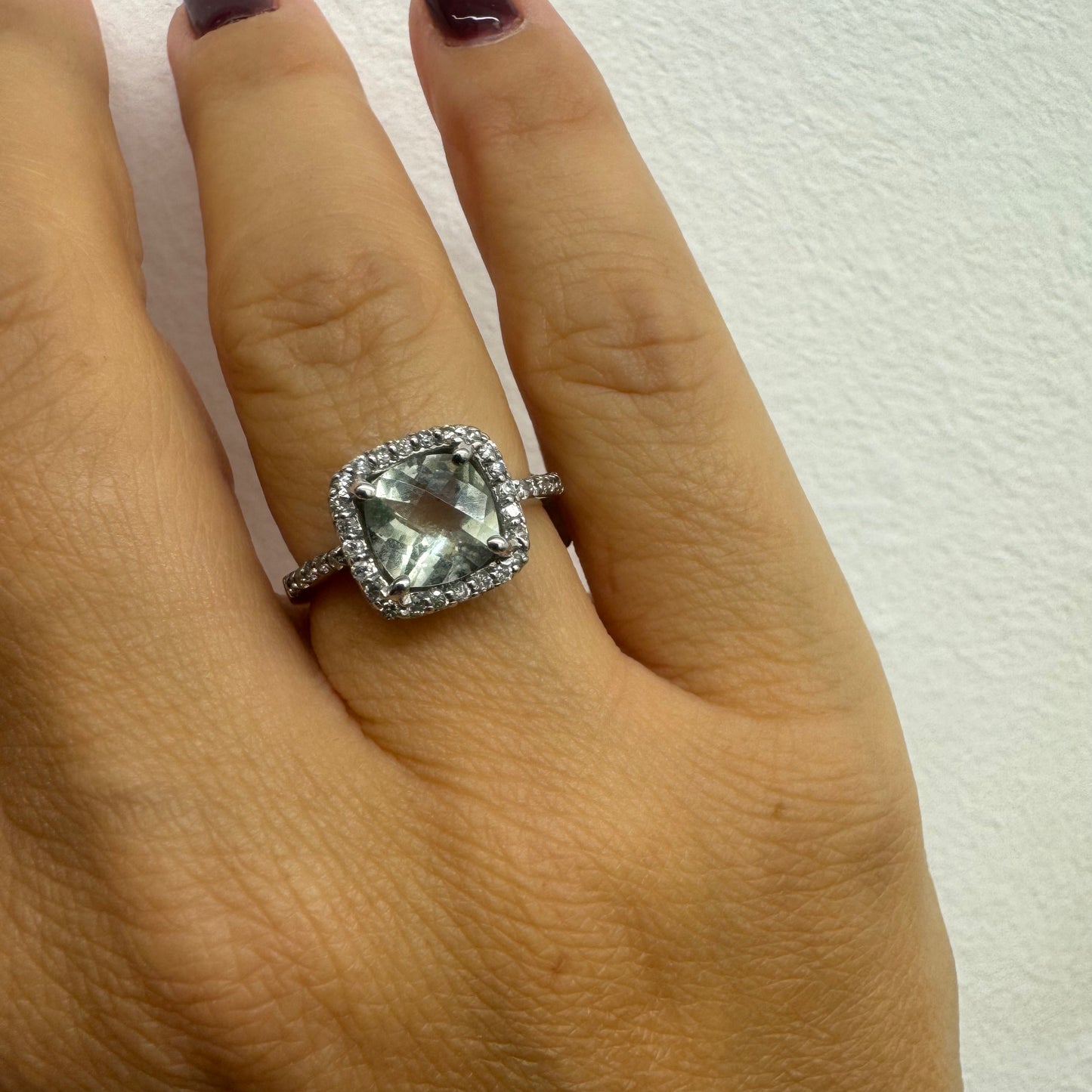 14K white gold ring featuring a cushion-cut light blue Aquamarine set in a sparkling double halo of round-cut Diamonds.