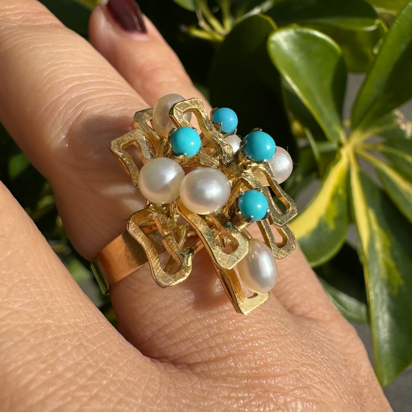 14K gold ring with a textured design, set with round white pearls and turquoise stones for a striking contrast.