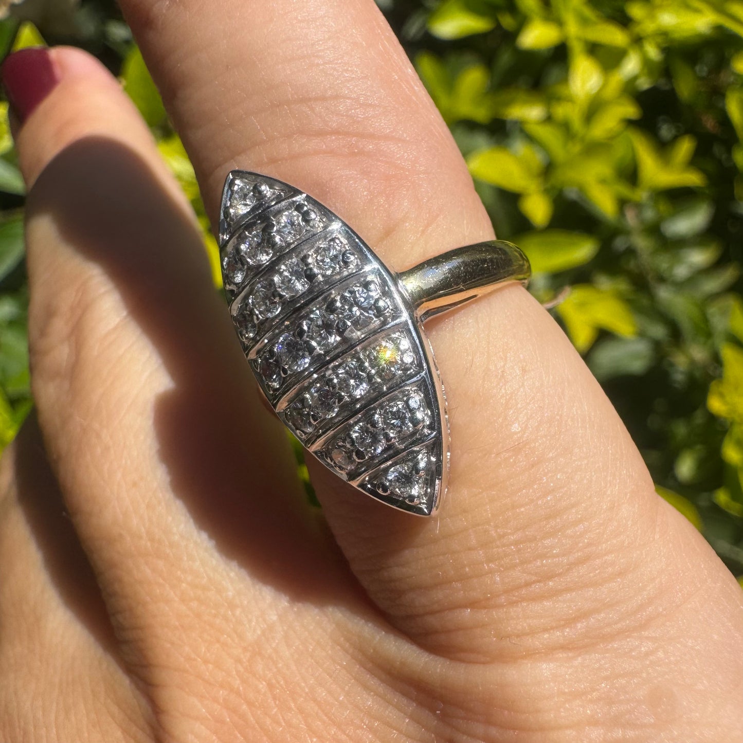 18K gold marquise-shaped ring set with multiple rows of sparkling Diamonds